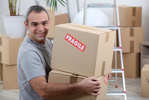 Removal team handling house move in Walthamstow street