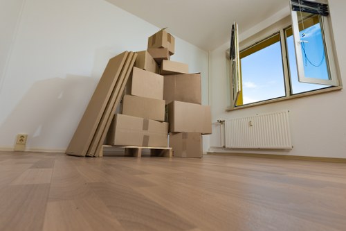 Removal van and movers assisting a business move in East London