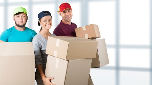 Business relocation scene showing office equipment being loaded for transport