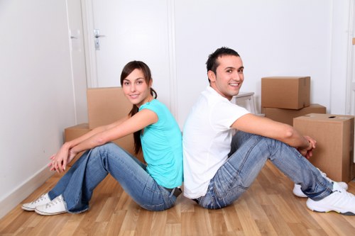 Professional office movers handling business furniture in a Walthamstow workspace