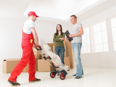 Safe and careful moving team with protective equipment