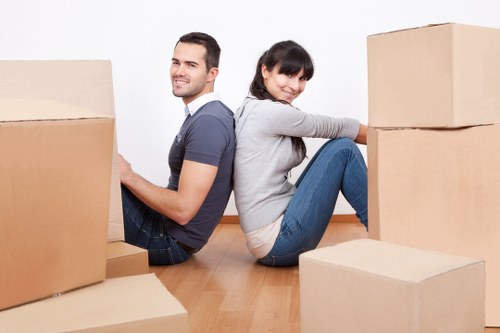 Packed moving boxes and furniture ready for a home removal service