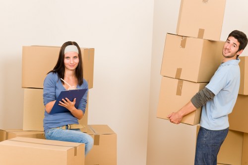 Loading household furniture into a moving van in Walthamstow