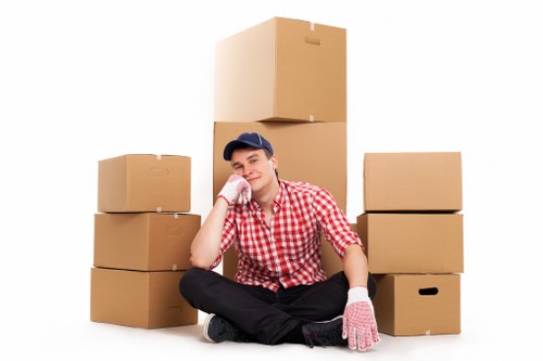 Boxes and household items being loaded into a removals van